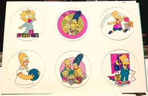 STYLE #2 THE SIMPSONS SET/6 OLDER POGS ON CARD PUNCHED MILK CAPS MINT MAGGIE etc - Picture 1 of 1
