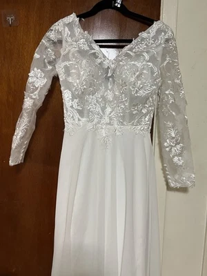 Elegant Long-Sleeve Lace Wedding Dress with Floral Embroidery - Image 1 of 4