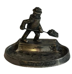 Posacenere vintage Iron Fireman metallo arte pubblicità piatto bigiotteria A.C. Rehberger Co. - Foto 1 di 13