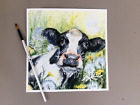 A limited edition print of cow and dandelions