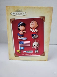 Hallmark Keepsake Ornament 2004 The Peanuts Games Set de 4 Snoopy/Lucy/CB/Madera - Imagen 1 de 6
