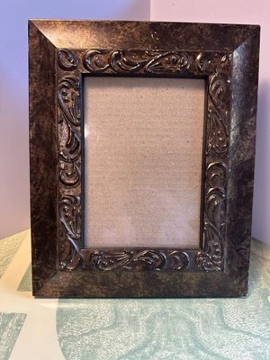 Foto redemoinho bronze metal sobre madeira veludo traseira 5x7 design BSS - Imagem 1 de 4