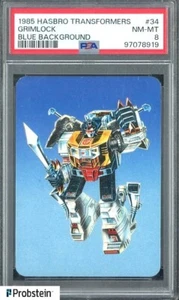 1985 Hasbro Transformers #34 Grimock Blue Backgrounf PSA 8 NM-MT - Picture 1 of 2
