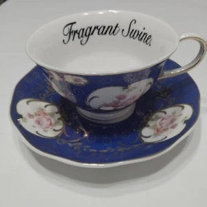 Miss Havisham's Blue Floral Fragrant Swine Insult Tea Cup & Saucer - Picture 1 of 15