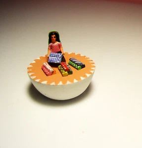 Vtge Ceramic Miniature Lady Selling Chritsmas Wrapping on a Muffin 1.5" Diameter - Picture 1 of 3