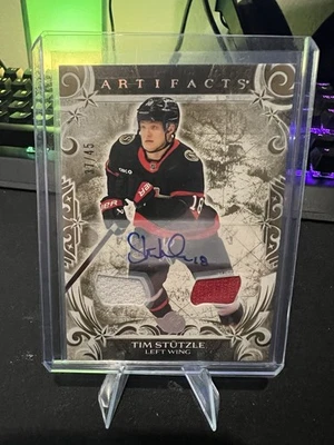 24-25 Artifacts Tim Stutzle Gold Auto Materials /45 - Image 1 of 2
