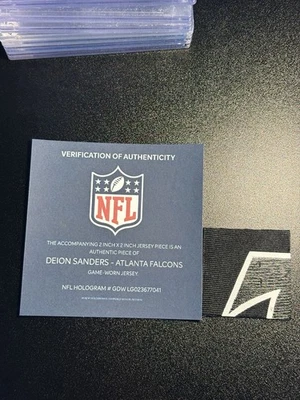 Parche Jersey Deion Sanders Juego Usado LOGOTIPO DE HALCONES CERTIFICADO DE AUTENTICIDAD NFL HOLOGRAMA HOF Foto 1 de 4