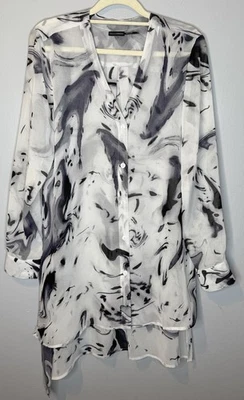 Top túnica Stella Carakasi pequeño manga larga blanco transparente cuello en V botón delantero Foto 1 de 4