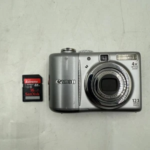 Cámara digital Canon PowerShot A1100 IS 12,1 MP 4X zoom 16 GB tarjeta SD plateada - Imagen 1 de 19