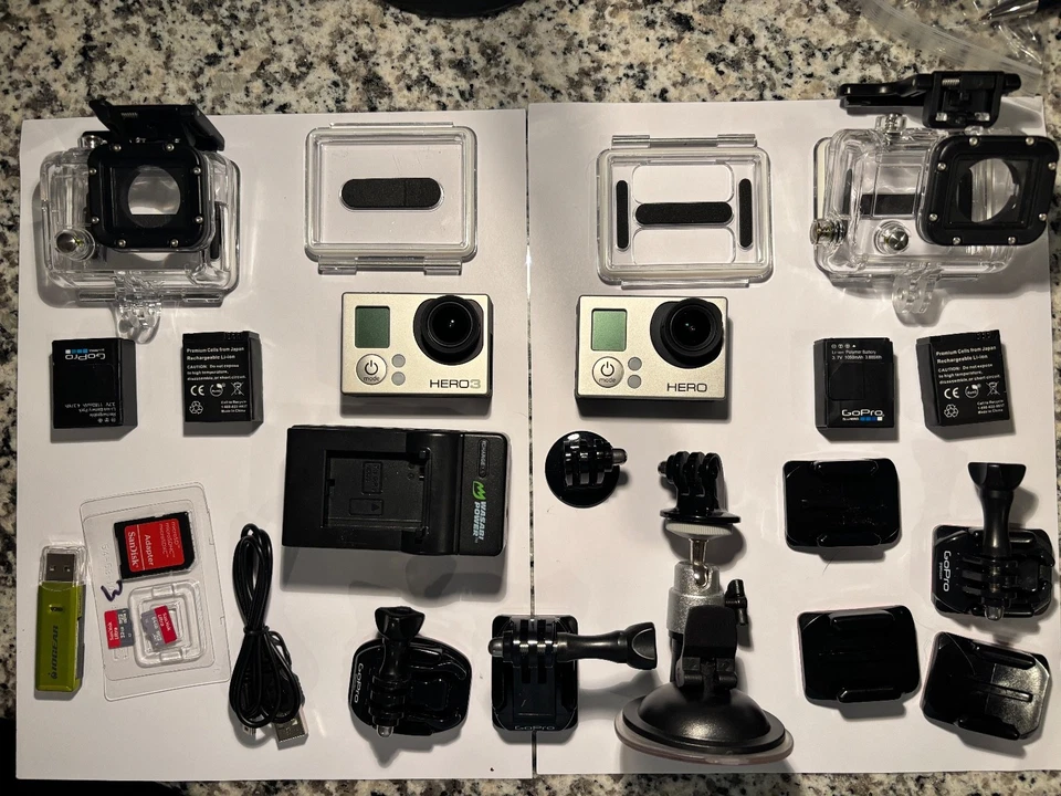 2 Silver GoPro HERO3 cameras, plus various accessories.  - Image 1 of 1