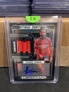 Autógrafos de material de obsidiana Panini 2023-24 Fikayo Tomori #MM-FT/199 (AU, MEM) - Imagen 1 de 2