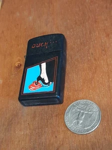 Vtg Lighter Ouch... Womans Heel Stabbed Heart ForPartsOrRepair Metal Black J29 - Picture 1 of 7