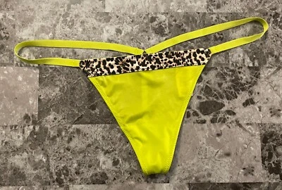 NUEVO CON ETIQUETAS BRAGAS VICTORIA'S SECRET O/S SATINADAS LISAS NEÓN AMARILLO LEOPARDO RARAS CUERDA EN V Foto 1 de 4