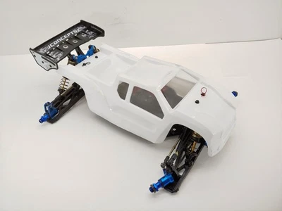 Team Associated RC8TE 1/8 4x4 Electric Truggy Roller Slider Chassis w/ Body Used - Image 1 of 4