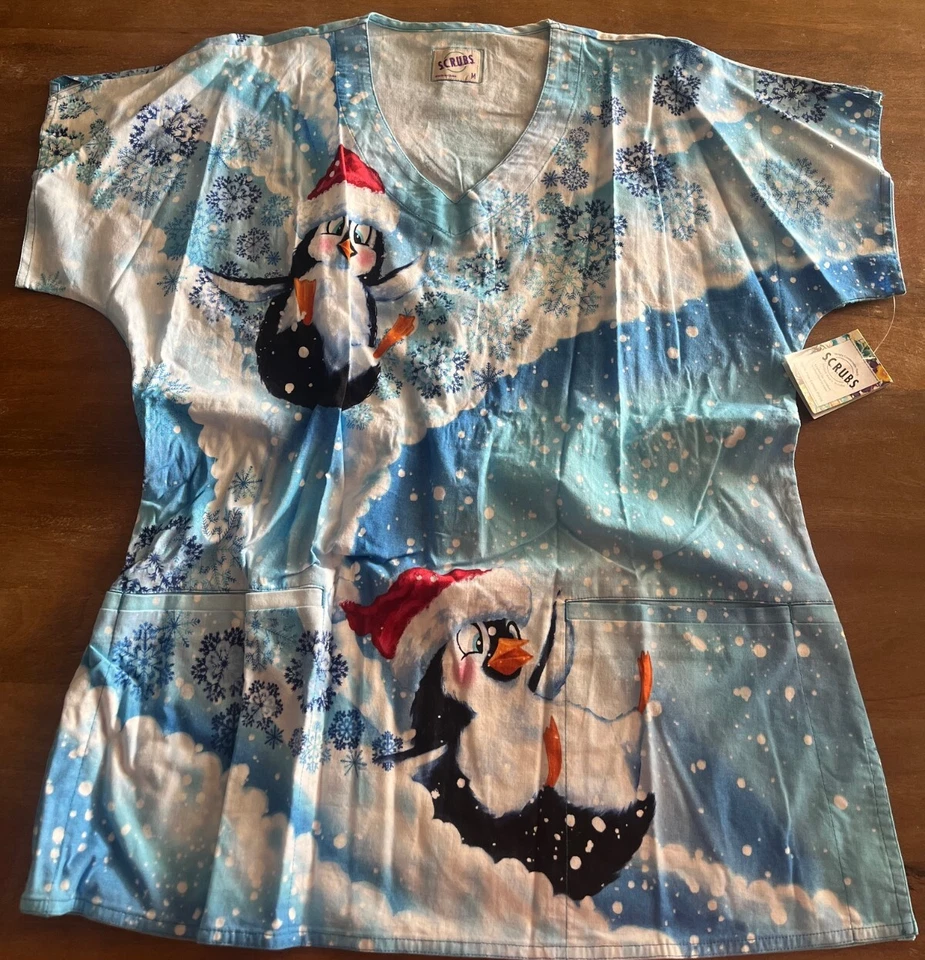NEW S.C.R.U.B.S. Scrub Top Size Unisex Medium Christmas Holiday Snow Penguins - Image 1 of 4