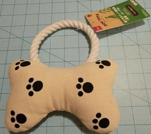 Marca Daiso: juguete chirrido para perro beige con estampado de pata en forma de hueso - Imagen 1 de 9