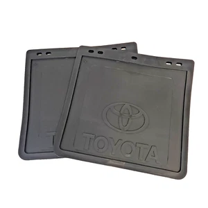 TOYOTA HILUX ALLOY TRAY MUDFLAPS PAIR FROM FEB 2005 GENUINE ACCESSORY 285 X 297 - Picture 1 of 2