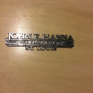 VINTAGE JOHN E. HANNA OLDSMOBILE St. LOUIS MO. Metal AUTO Dealer Emblem Trunk - Picture 1 of 6