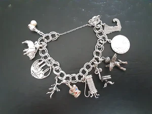 VINTAGE STIRLING SILVER BRACELET WITH 10 STERLING TRAVEL ORIENTED CHARMS - Picture 1 of 5