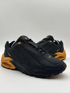 Size 9.5 - Nike NOCTA x Hot Step Air Terra Black University Gold - Picture 1 of 11