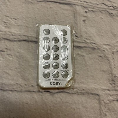 Coby Digital Photo Frame Slideshow Remote Control Silver White. - Image 1 of 2