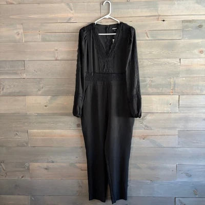 EXPRESS | NWT Black V-Neck Jumpsuit Lace Detailing Size 10  - Image 1 of 4