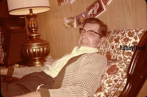 Vintage 35MM Slide Man Sitting in chair with Christmas Cards on the wall 70's - Picture 1 of 2