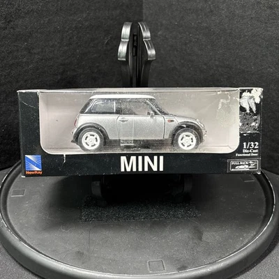 New Ray Yellow 2002 Mini Cooper, 1:32, Diecast Pull Back New But Damaged Box - Image 1 of 4