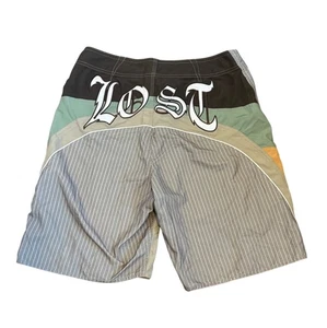 Vintage Lost Enterprises Mens Board Shorts Size 34 Multi-Color Patchwork Logo - Picture 1 of 8