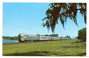 1976 - Amtrak's northbound The Champion on SCL at Lake Alfred FL Train Postcard