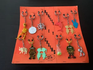 Vtg Toy Novelty Key Chains Vending Machine Display Robots Skeletons Peace Charms - Picture 1 of 12