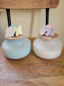 TWO LARGE CERAMIC TOPPED TK MAXX SPRING GLASS CANDLES - Picture 1 of 3