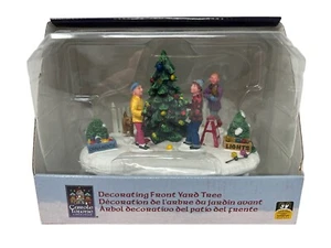 2009 Lemax Christmas Carole Towne Collection: Decorating Front Yard Tree, #94056 - Picture 1 of 12