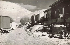 RPPC  Main Street Arco Idaho, Dept Store, Butte Bar & Cafe, Dated 1952  Snow - Picture 1 of 2