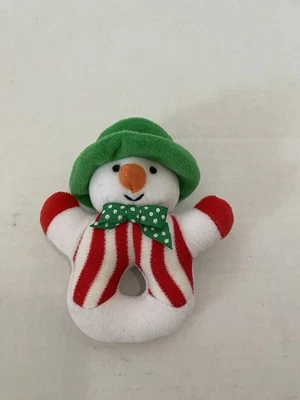 Pequeño muñeco de nieve de felpa Eden sonajero rayas rojas sombrero verde arco a lunares Foto 1 de 3