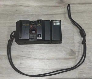Macchina fotografica vintage CANON MC obiettivo 35 mm messa a fuoco automatica CAFS PER RICAMBI/RIPARAZIONE NON TESTATA - Foto 1 di 12