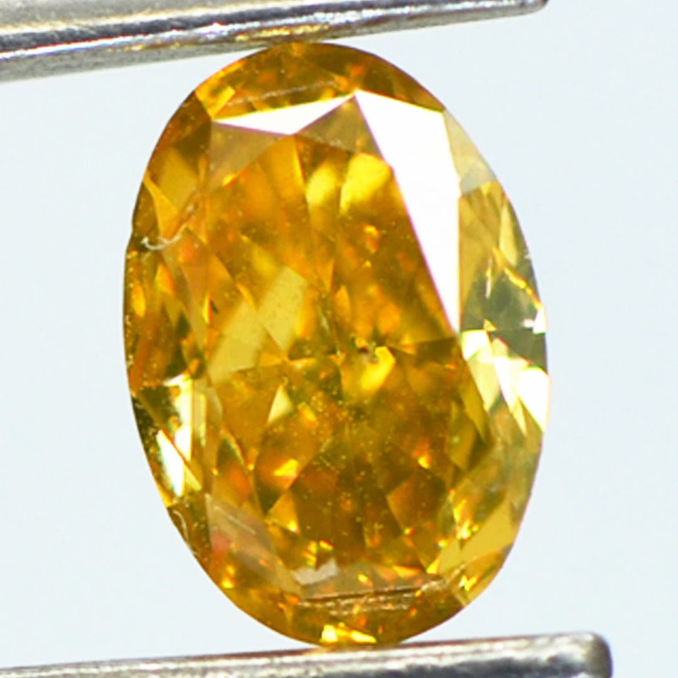 Fancy Orangey Yellow Diamond Loose Oval Shape VS1 Natural Enhanced 0.53 Carat - Image 1 of 4