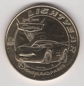 A-- 2011 COIN TOKEN JETON MONNAIE DE PARIS-- 77 DISNEYLAND DISNEY N°29 CARS 2 - Picture 1 of 2