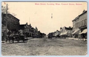 1912 COUNCIL GROVE MAIN STREET LOOKING WEST DIRT ROAD HORSES WAGON POSTCARD - Picture 1 of 2