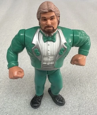 Figura de acción de colección WWF Hasbro Titan Sports 1991 Million Dollar Man traje verde Foto 1 de 4