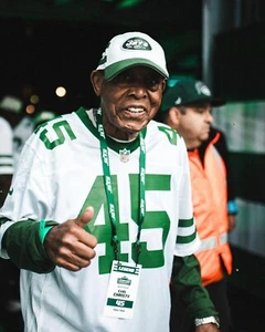Foto de fútbol americano de la NFL Earl Christy asistiendo a un juego de los New York Jets 8x10 - Imagen 1 de 1