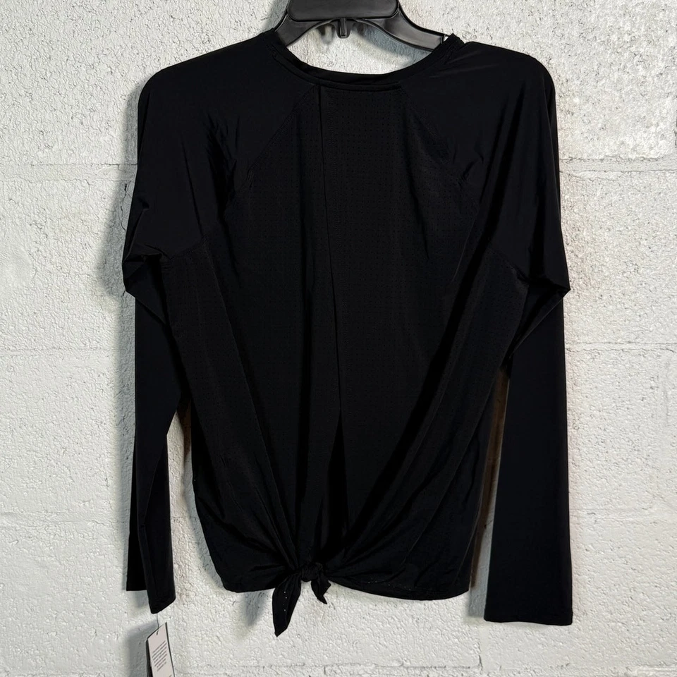 Top de mujer Ideology activo perforado con lazo en la espalda manga larga negro pequeño  Foto 1 de 4