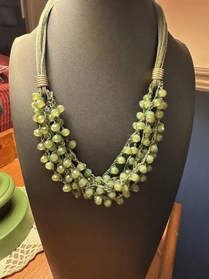 Olive Green 6 Strand 18” Beaded Necklace On Green Leather cords, gold tone clasp - Image 1 of 3