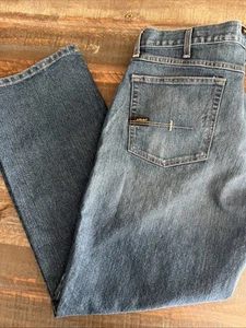 Vaqueros ARIAT 38x32 para hombre con barra de refuerzo M4 elástico relajado corte bota, carabina #10016221 - Imagen 1 de 12