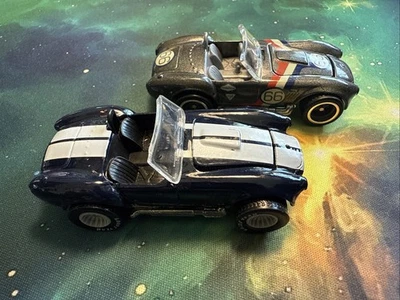 Juego de 2 autos Hot Wheels 1982 Cobra con pilotos reales Hong Kong y coche de garaje 🔥 suelto Foto 1 de 4