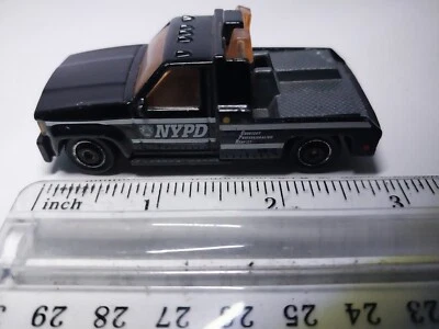1987 MATCHBOX GMC WRECKER NYPD BLACK 1:72 DIECAST POLICE TOW TRUCK WHITE STRIPES - Image 1 of 4