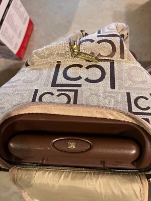 Liz Claiborne Brown and Tan 18” X 13” roll aboard duffel. Handle hides in base - Image 1 of 4