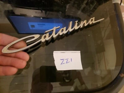 Pontiac Catalina 1961 emblema de puerta delantera OEM 4809795 Foto 1 de 4