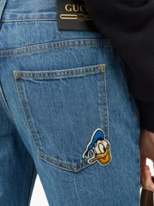 BNWT GUCCI X Disney Donald Duck distressed-hem flared jeans - Size 28 - RRP ?575 - Picture 1 of 12