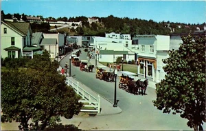 Main Street &Village HORSE DRAWN CARRIAGES Mackinac Island MICHIGAN POSTCARD D12 - Picture 1 of 2